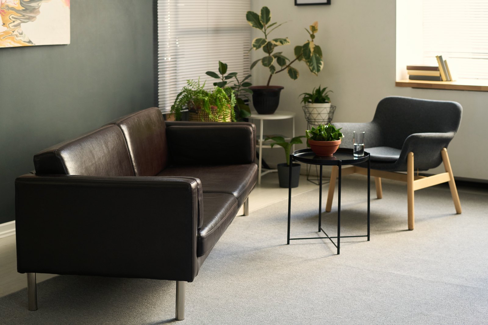 A warm, plant-filled therapy waiting room